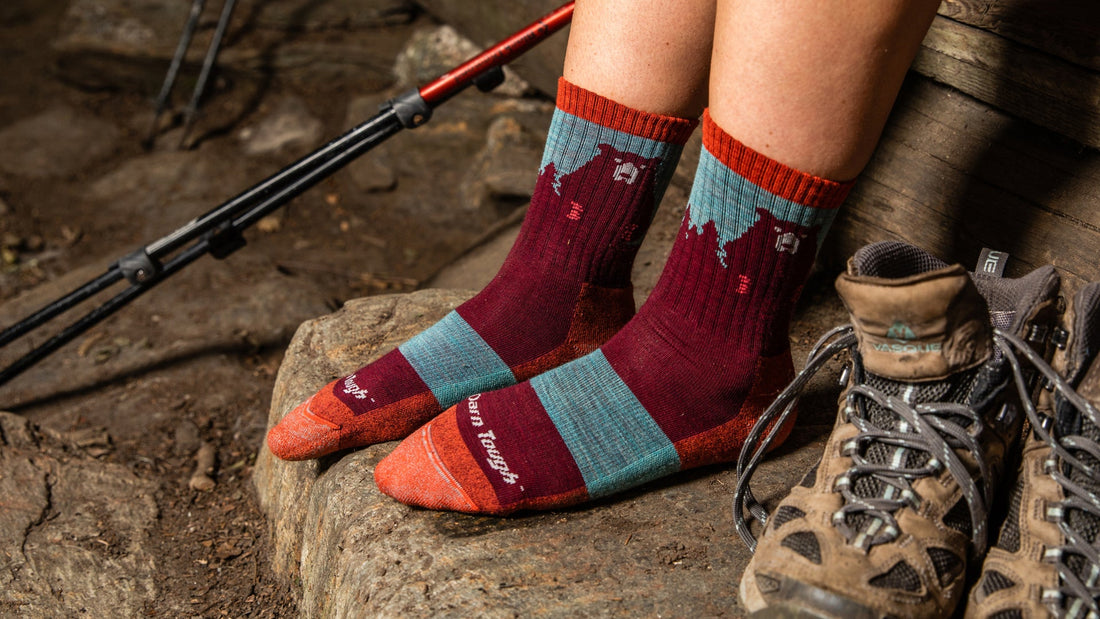 Model wearing the women's bear town micro crew hiking socks in cranberry
